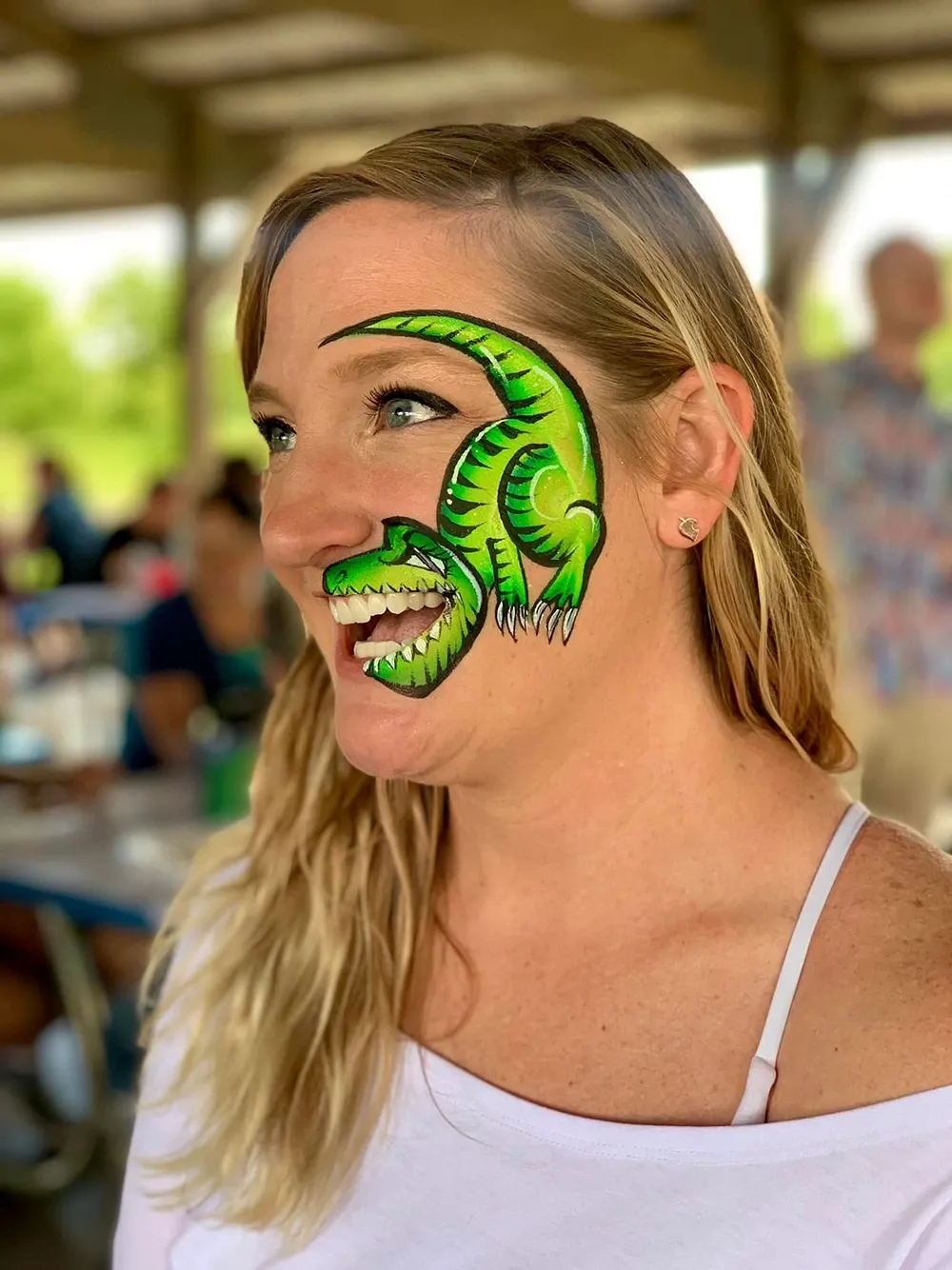 woman with dinosaur face paint