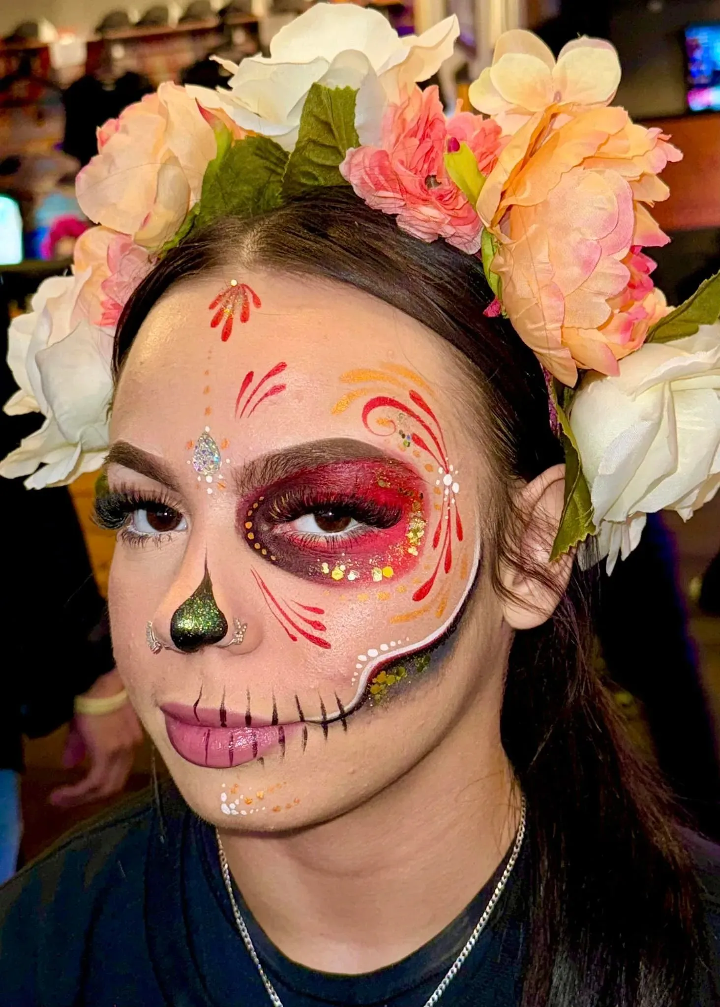 women with dia de los muertos face paint