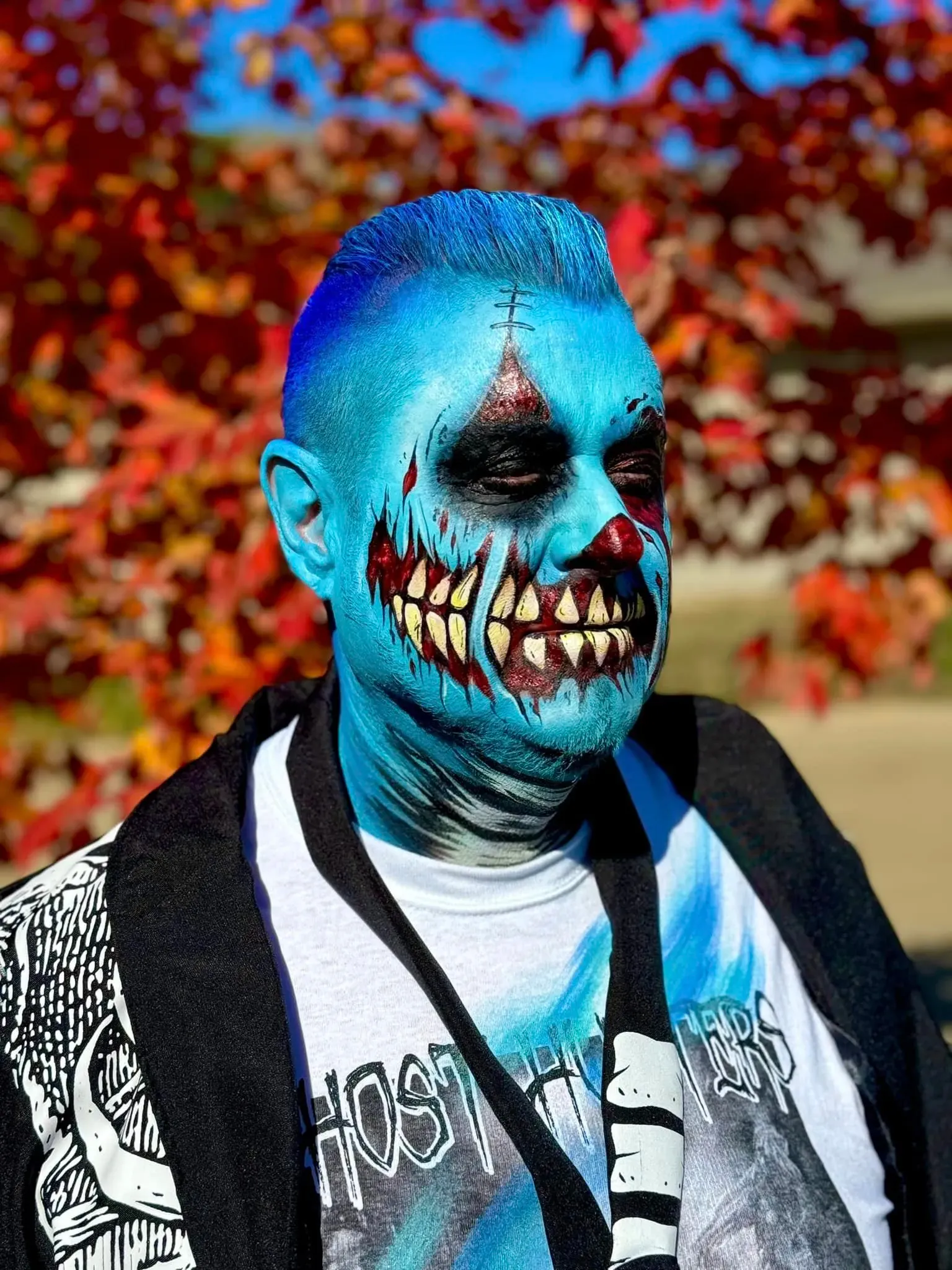 man with blue halloween full face paint