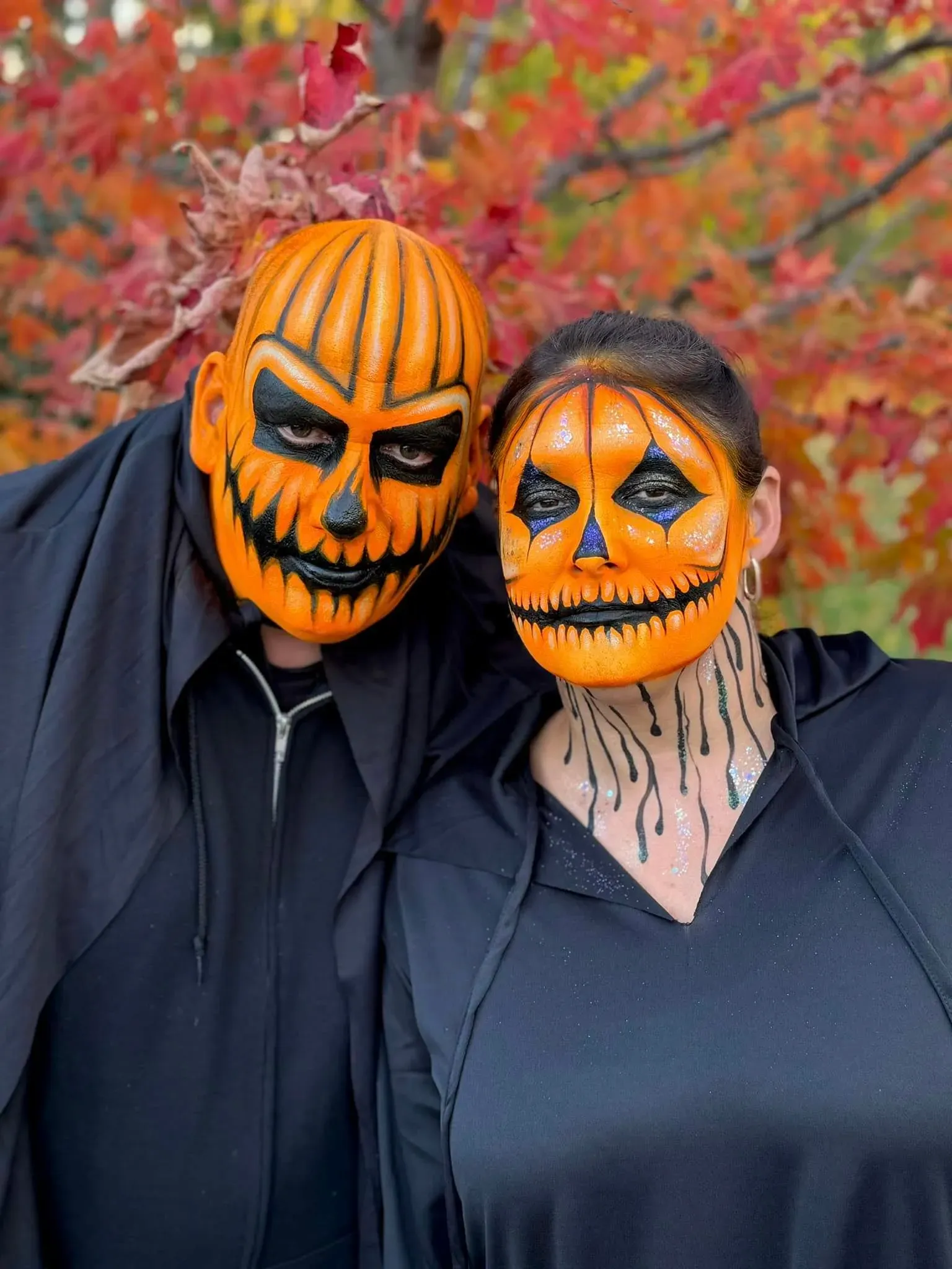 couple with halloween pumpkin full face paint