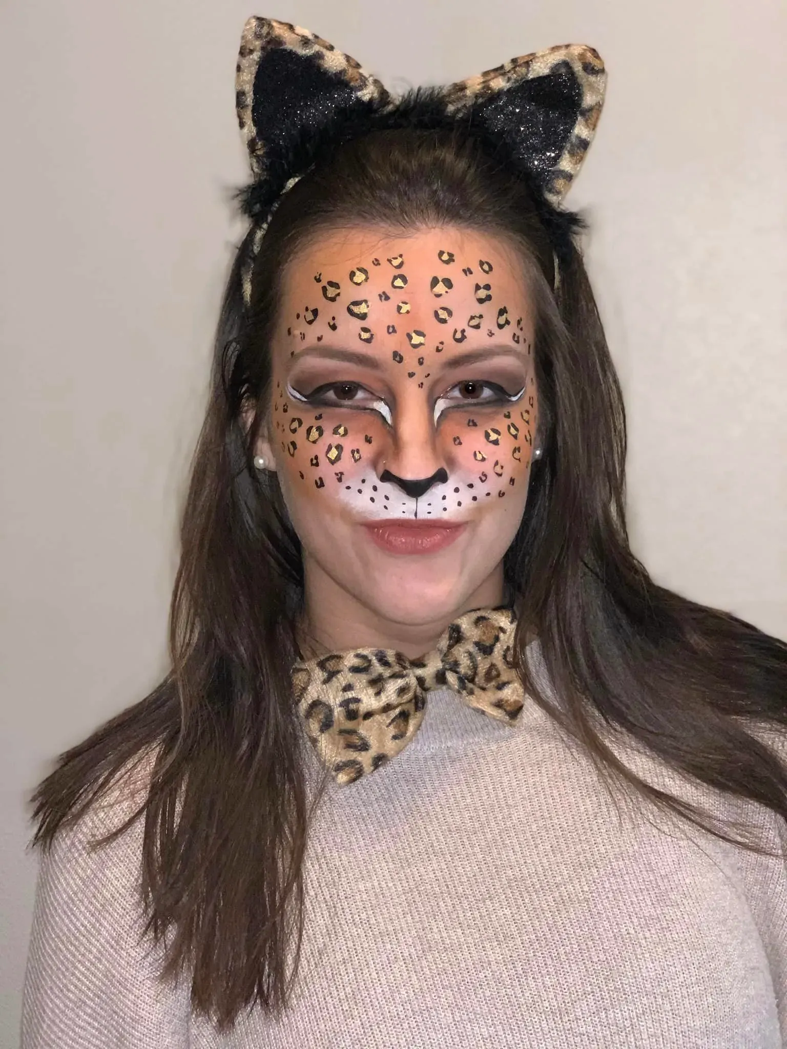 woman with cheetah face paint