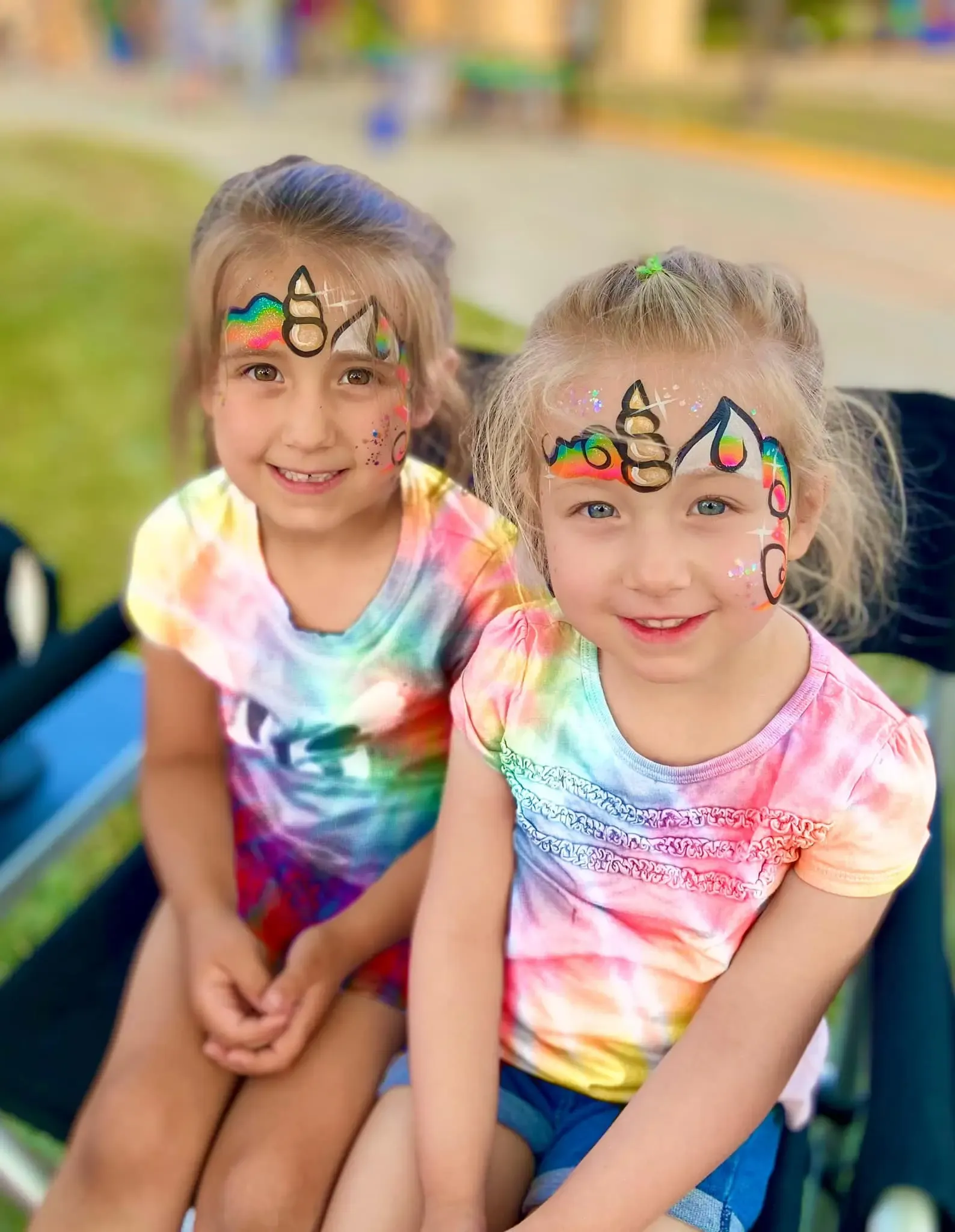 girls with rainbow unicorn face paint