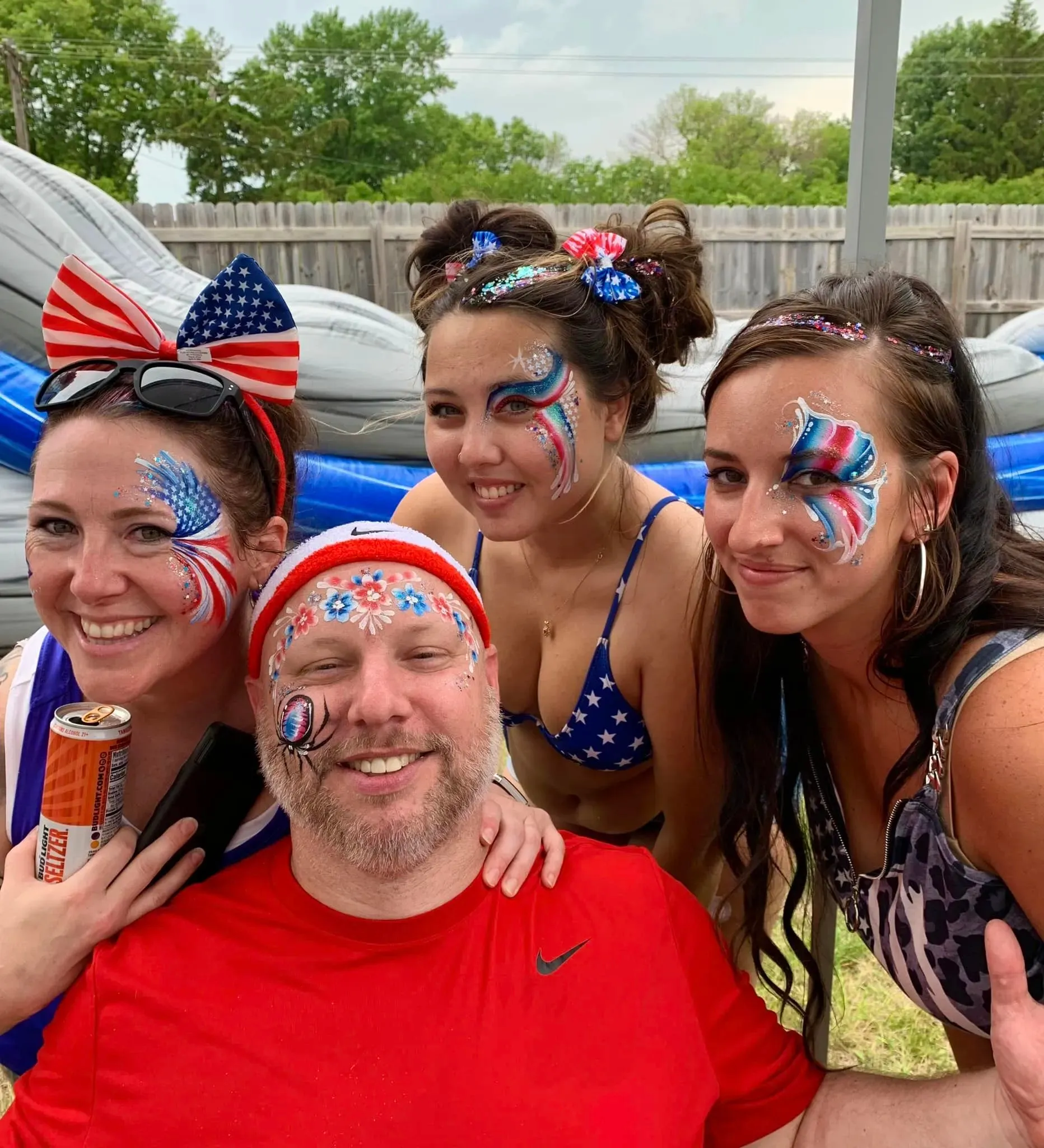 group with 4th of july waterproof glitter tattoos and face paint