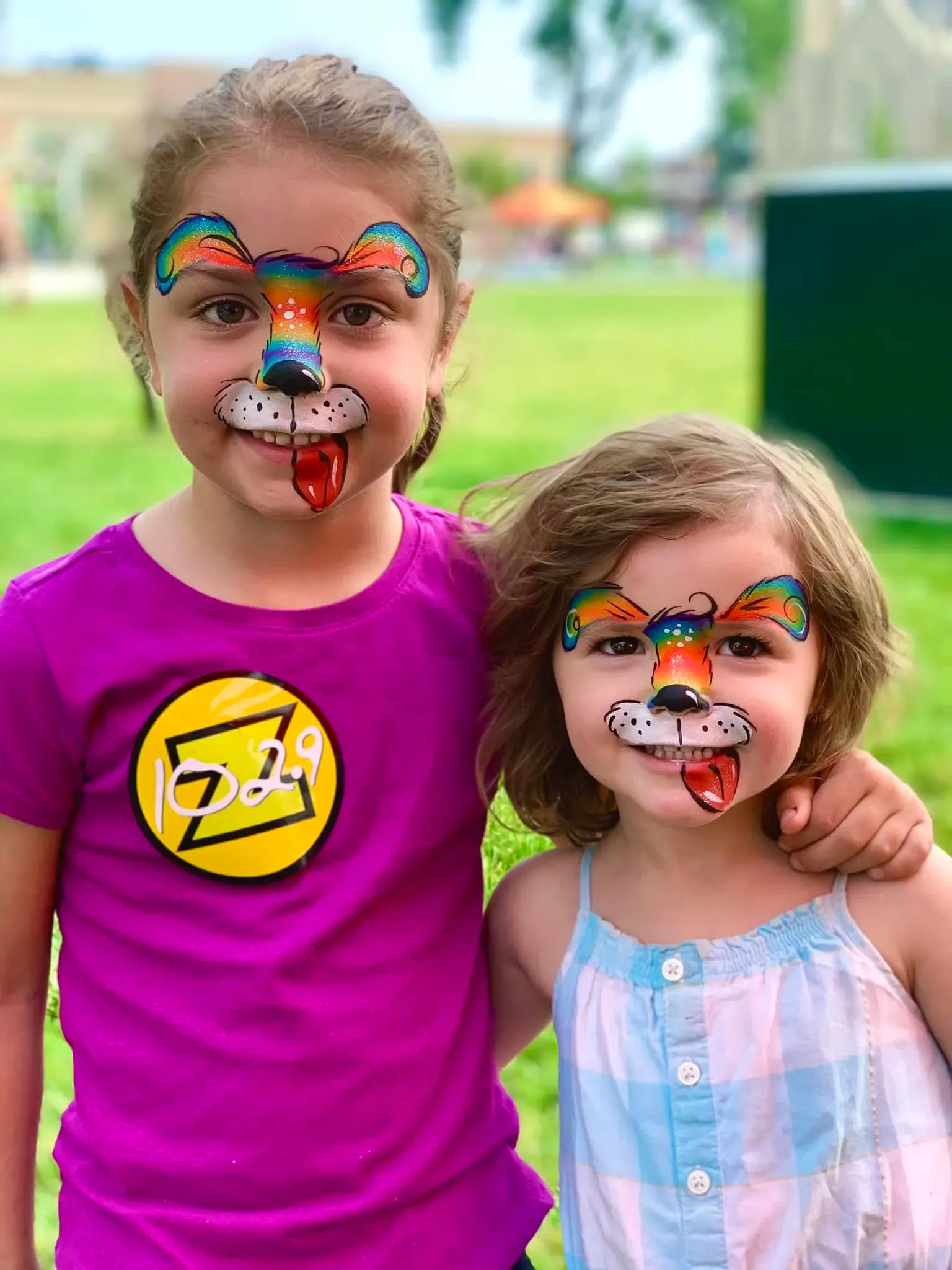 girls with rainbow dog face paint
