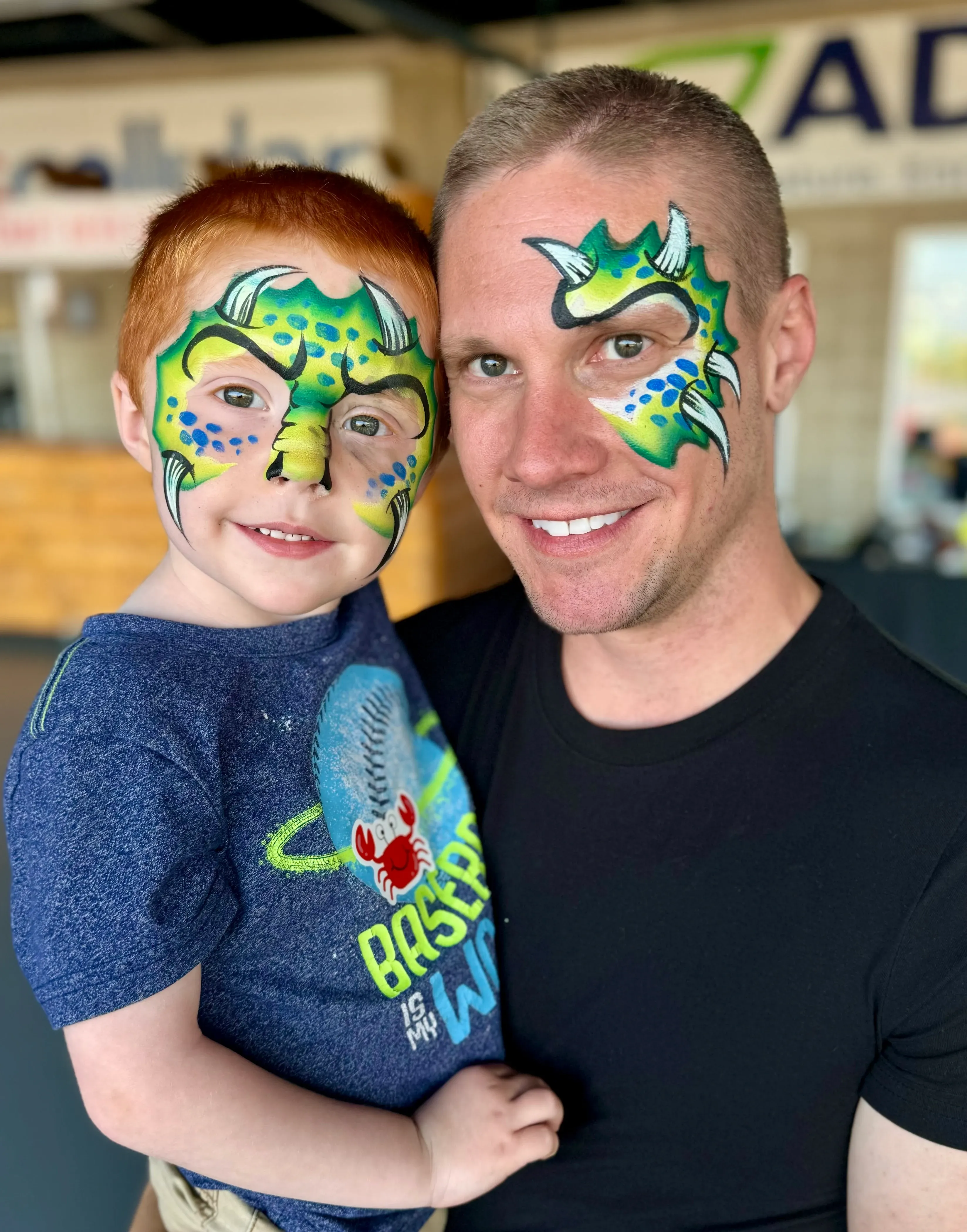 man and son with monster face paint
